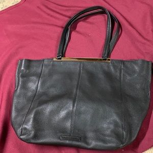 Vince  Camuto black bag is famous! You are going to love this bag.